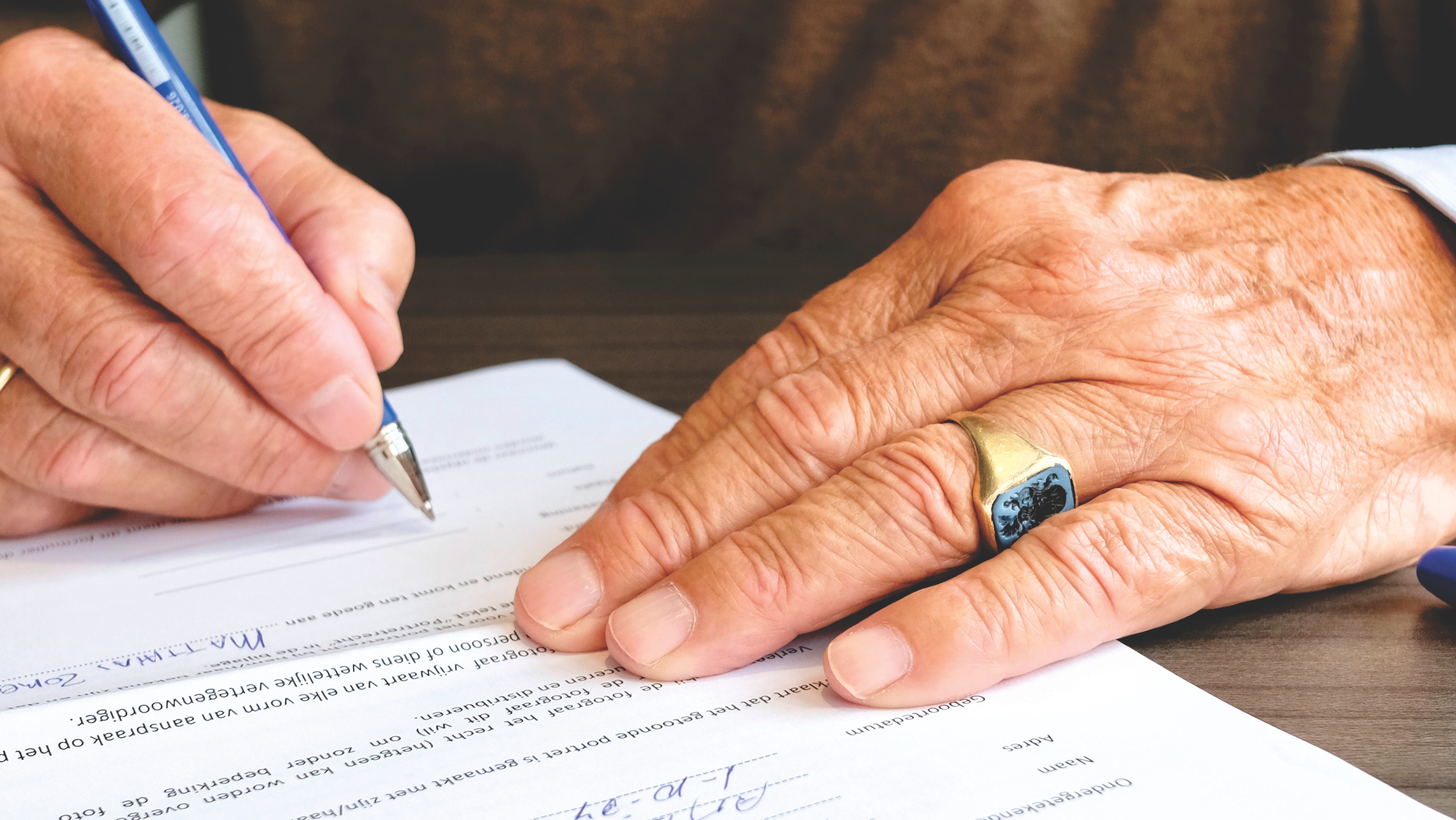 Man signing a will